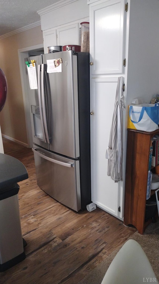 618 Prospect Rd, Hurt, VA 24563 - kitchen with white cabinets, ornamental molding, stainless steel refrigerator with ice dispenser, and dark wood-style floors
