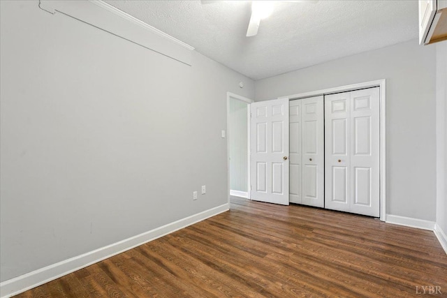 43 Nags Head Ct, Lynchburg, VA 24502 - unfurnished bedroom with dark wood-type flooring, baseboards, a textured ceiling, ceiling fan, and a closet