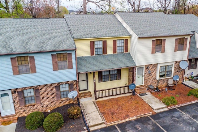 43 Nags Head Ct, Lynchburg, VA 24502 - townhome / multi-family property with uncovered parking, brick siding, a shingled roof, and entry steps