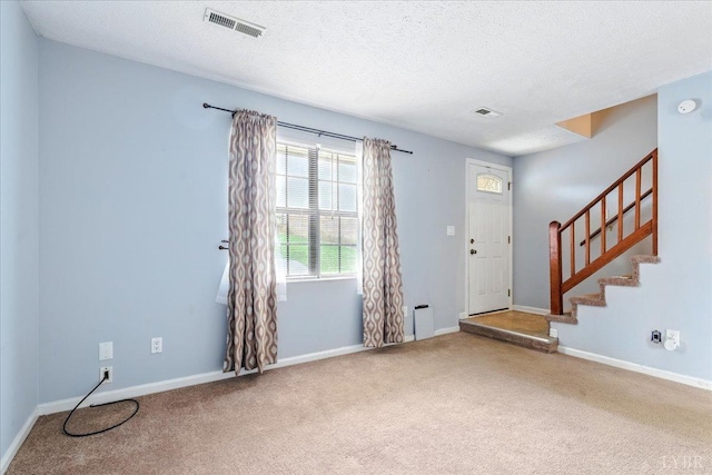 43 Nags Head Ct, Lynchburg, VA 24502 - carpeted entryway featuring stairway, a textured ceiling, and baseboards