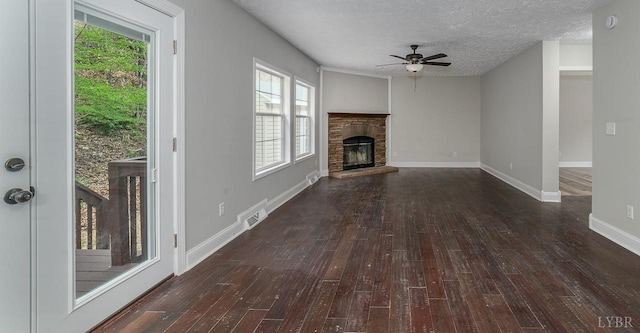 108 Trapper Ln, Vinton, VA 24179 - unfurnished living room featuring hardwood / wood-style flooring, a ceiling fan, plenty of natural light, and a textured ceiling