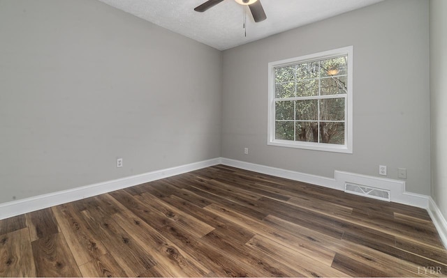 108 Trapper Ln, Vinton, VA 24179 - unfurnished room with ceiling fan, dark wood finished floors, baseboards, and a textured ceiling