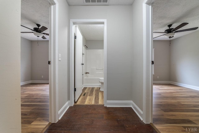 108 Trapper Ln, Vinton, VA 24179 - hall with wood finished floors, a textured ceiling, and baseboards