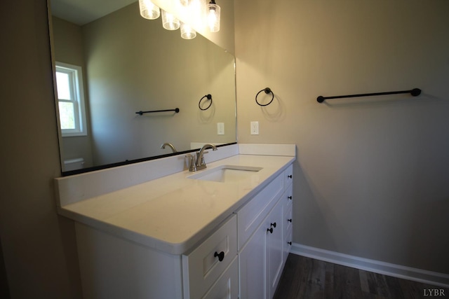 625 S St, Bedford, VA 24523 - bathroom featuring vanity, wood finished floors, baseboards, and toilet