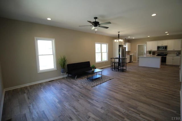 625 S St, Bedford, VA 24523 - living area featuring recessed lighting, dark wood-style flooring, ceiling fan, baseboards, and a chandelier