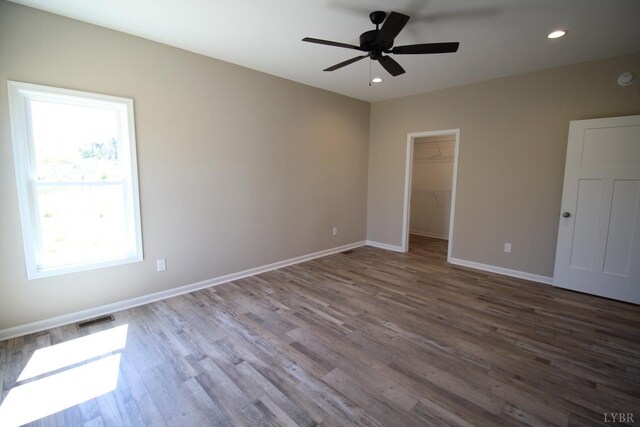 625 S St, Bedford, VA 24523 - unfurnished bedroom featuring wood finished floors, baseboards, recessed lighting, a spacious closet, and a ceiling fan