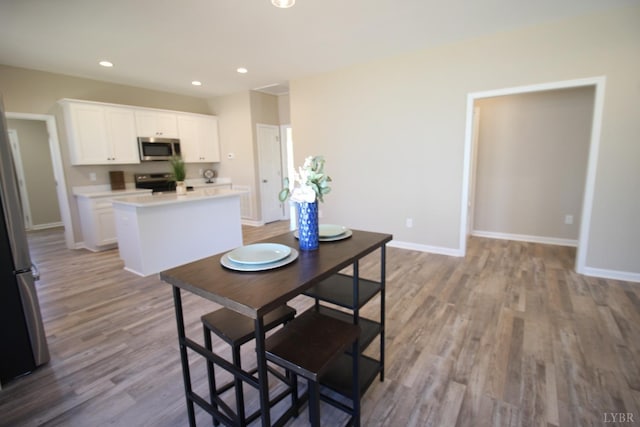 625 S St, Bedford, VA 24523 - dining space featuring wood finished floors, recessed lighting, and baseboards