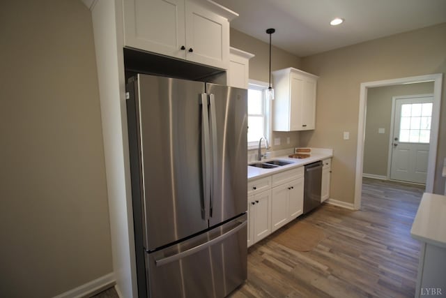 625 S St, Bedford, VA 24523 - kitchen with appliances with stainless steel finishes, a sink, light countertops, white cabinets, and dark wood-style flooring