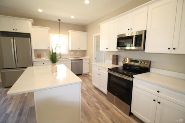 625 S St, Bedford, VA 24523 - kitchen with stainless steel appliances, recessed lighting, white cabinetry, light wood-style floors, and light countertops