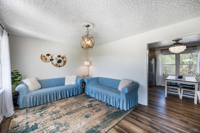 2477 Mountain Rd, Gretna, VA 24557 - living area featuring a chandelier, a textured ceiling, and wood finished floors