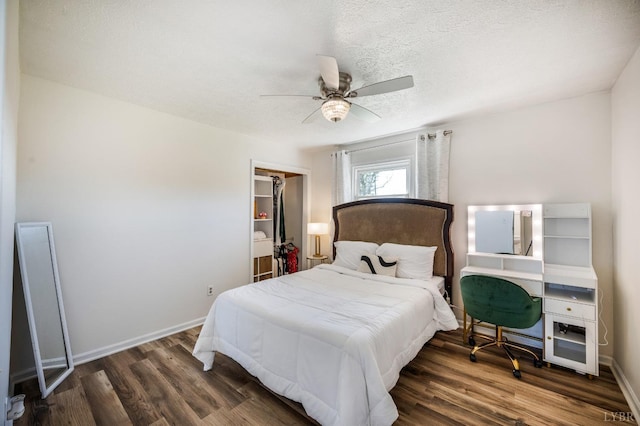 2477 Mountain Rd, Gretna, VA 24557 - bedroom featuring baseboards, a textured ceiling, a ceiling fan, and wood finished floors