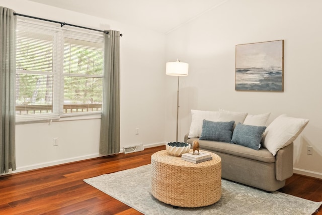 303 Somerset Pl, Rustburg, VA 24588 - living area featuring healthy amount of natural light, wood finished floors, and vaulted ceiling