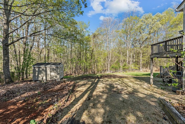 303 Somerset Pl, Rustburg, VA 24588 - view of yard featuring a shed, a deck, a view of trees, and stairs