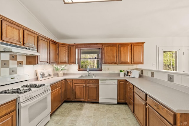 303 Somerset Pl, Rustburg, VA 24588 - kitchen featuring white appliances, under cabinet range hood, lofted ceiling, brown cabinetry, and tasteful backsplash