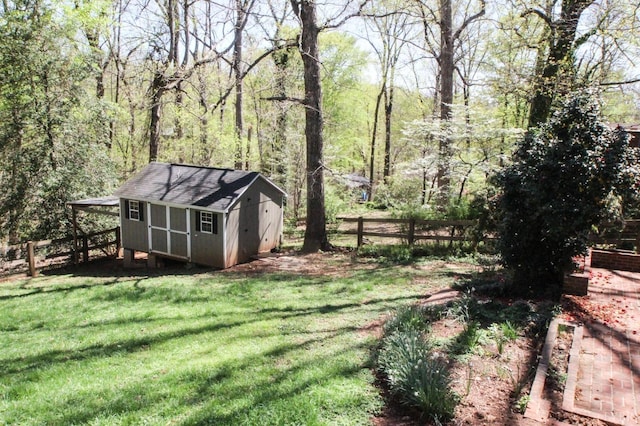 1428 Club Dr, Lynchburg, VA 24503 - view of yard featuring a storage shed, an outbuilding, and a wooded view
