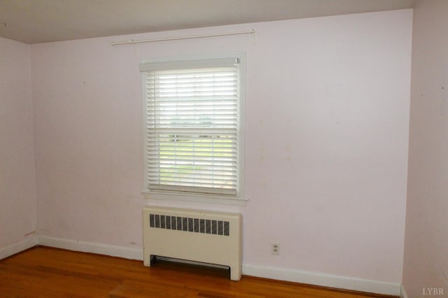 1428 Club Dr, Lynchburg, VA 24503 - spare room featuring radiator, wood finished floors, and baseboards