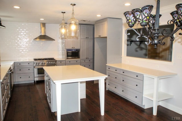 1428 Club Dr, Lynchburg, VA 24503 - kitchen featuring appliances with stainless steel finishes, wall chimney range hood, dark wood-style flooring, and recessed lighting
