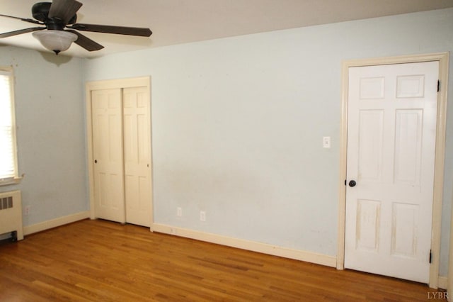 1428 Club Dr, Lynchburg, VA 24503 - empty room with ceiling fan, wood finished floors, baseboards, and radiator heating unit