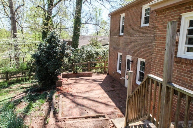 1428 Club Dr, Lynchburg, VA 24503 - view of home's exterior with brick siding, fence, and a patio area