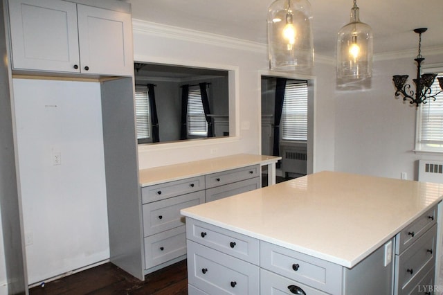 1428 Club Dr, Lynchburg, VA 24503 - kitchen with gray cabinets, crown molding, light countertops, a kitchen island, and hanging light fixtures