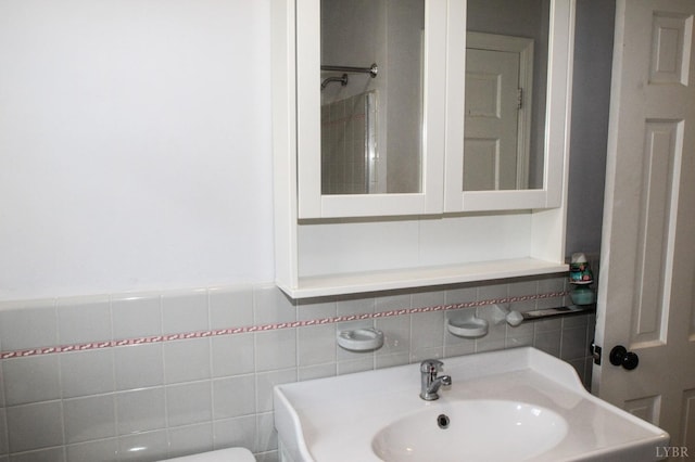 1428 Club Dr, Lynchburg, VA 24503 - bathroom featuring a sink, tile walls, backsplash, and a shower