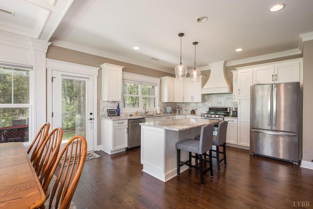 1085 Tori Ct, Forest, VA 24551 - kitchen featuring decorative backsplash, appliances with stainless steel finishes, premium range hood, and a kitchen island