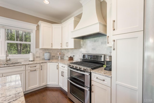1085 Tori Ct, Forest, VA 24551 - kitchen featuring a sink, premium range hood, crown molding, white cabinetry, and range with two ovens