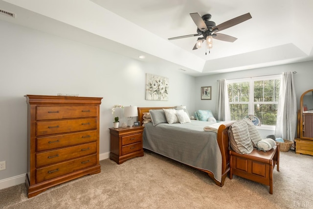 1085 Tori Ct, Forest, VA 24551 - bedroom with ceiling fan, a tray ceiling, visible vents, light carpet, and baseboards