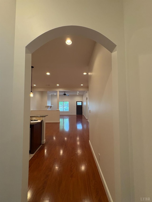 621 Capstone Dr, Lynchburg, VA 24502 - hall featuring arched walkways, dark wood-style floors, recessed lighting, and baseboards