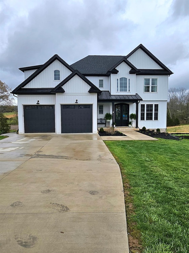 1192 Elk Creek Rd, Forest, VA 24551 - modern farmhouse with a standing seam roof, metal roof, a front yard, a shingled roof, and concrete driveway
