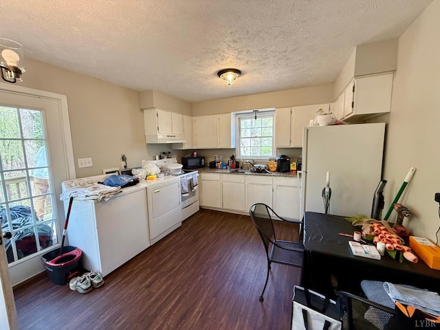 126 Berkley Pl, Madison Heights, VA 24572 - kitchen featuring freestanding refrigerator, range, black microwave, dark wood-type flooring, and washing machine and dryer