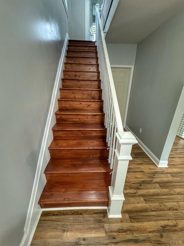 1225 Early St, Lynchburg, VA 24502 - staircase featuring wood finished floors and baseboards