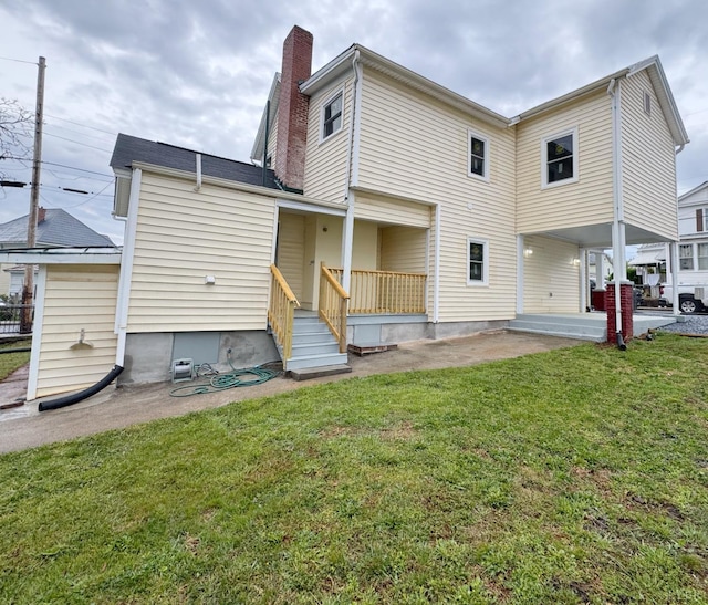 1225 Early St, Lynchburg, VA 24502 - rear view of property featuring a lawn and a chimney