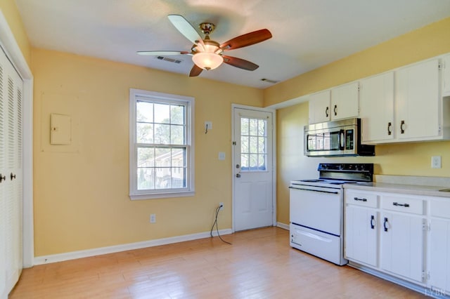 8108 Timberlake Rd Unit 135, Lynchburg, VA 24502 - kitchen with stainless steel microwave, white electric range, light wood finished floors, and ceiling fan