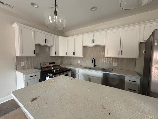 1026 Misty Mountain Rd, Lynchburg, VA 24502 - kitchen featuring electric range, a sink, decorative backsplash, and white cabinets