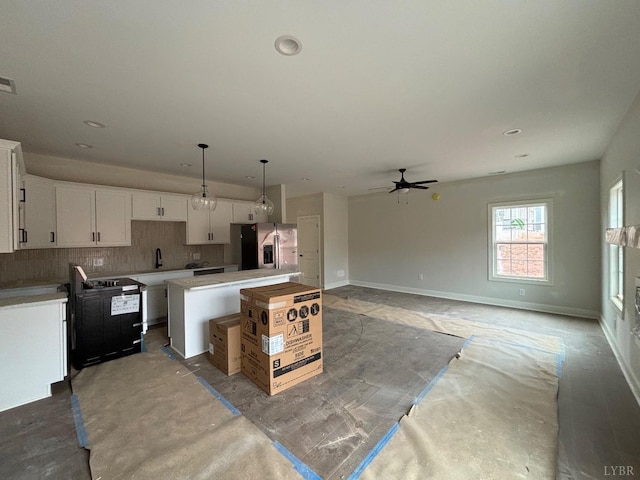 1026 Misty Mountain Rd, Lynchburg, VA 24502 - kitchen with stainless steel fridge, a center island, ceiling fan, backsplash, and a sink