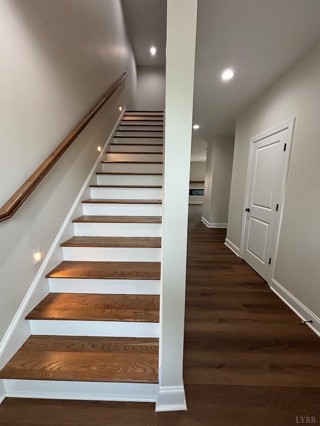 stairs featuring recessed lighting, wood finished floors, and baseboards
