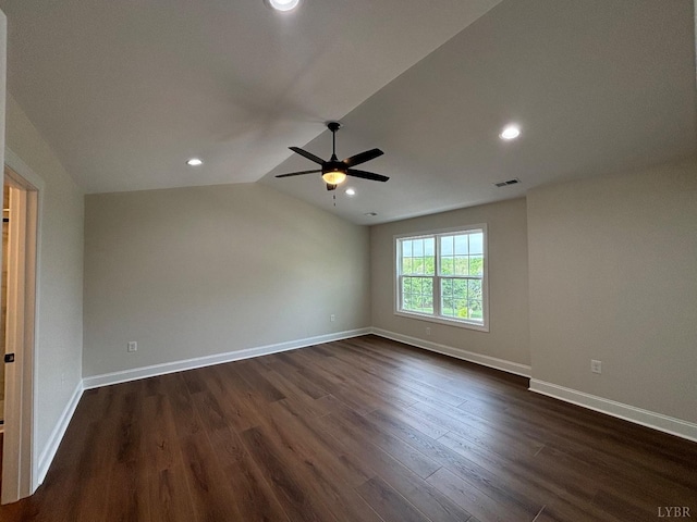 empty room with ceiling fan, baseboards, dark wood-style floors, and visible vents