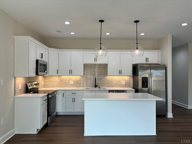 536 Leesville Rd Unit 301, Lynchburg, VA 24502 - kitchen with appliances with stainless steel finishes, a kitchen island, recessed lighting, white cabinets, and light countertops