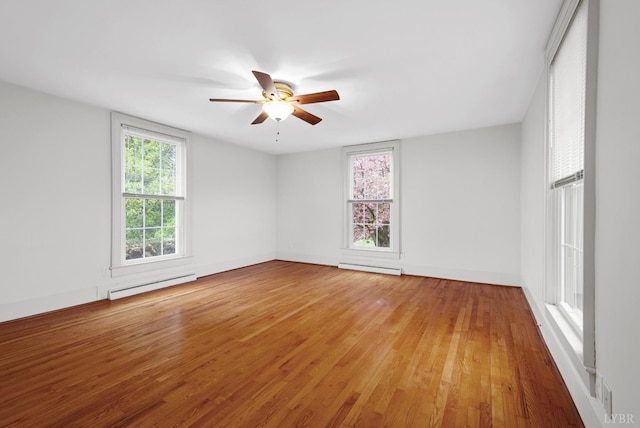 281 Calohan Rd, Rustburg, VA 24588 - unfurnished room featuring a baseboard heating unit, light wood-style floors, and a ceiling fan