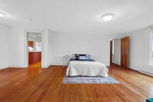 281 Calohan Rd, Rustburg, VA 24588 - bedroom featuring a baseboard heating unit, baseboards, and hardwood / wood-style flooring