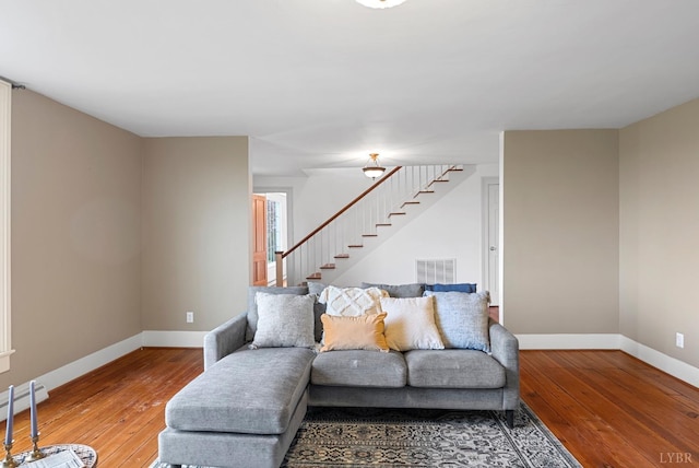 281 Calohan Rd, Rustburg, VA 24588 - living room with visible vents, baseboards, stairway, and wood-type flooring