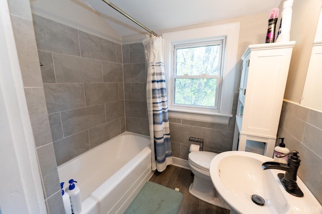 299 Alum Springs Rd, Lynchburg, VA 24502 - bathroom with a sink, tile walls, wood finished floors, shower / tub combo with curtain, and toilet