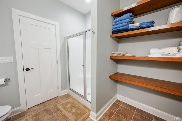 1310 Whispering Springs Ct, Forest, VA 24551 - bathroom featuring baseboards, tile patterned floors, a shower stall, and toilet