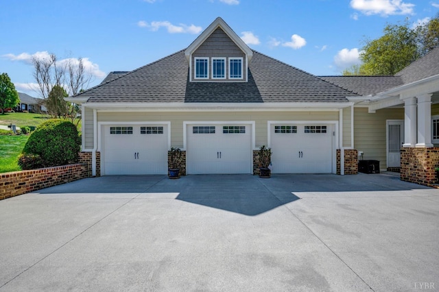1310 Whispering Springs Ct, Forest, VA 24551 - view of home's exterior featuring an attached garage, a shingled roof, stone siding, and concrete driveway