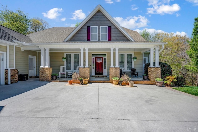 1310 Whispering Springs Ct, Forest, VA 24551 - craftsman-style home featuring roof with shingles and covered porch