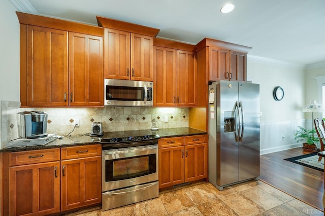 1310 Whispering Springs Ct, Forest, VA 24551 - kitchen featuring ornamental molding, appliances with stainless steel finishes, and brown cabinets