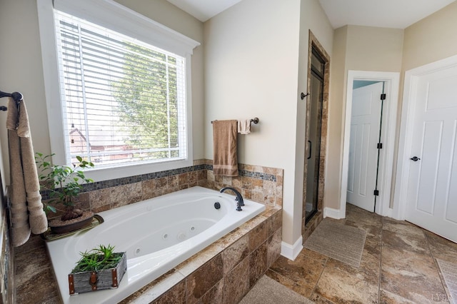 1310 Whispering Springs Ct, Forest, VA 24551 - full bath with a tub with jets, stone tile floors, baseboards, and a shower stall