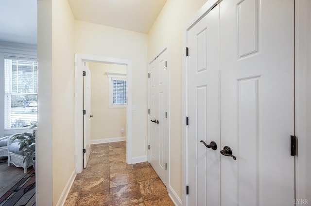 1310 Whispering Springs Ct, Forest, VA 24551 - hallway featuring baseboards and stone finish flooring