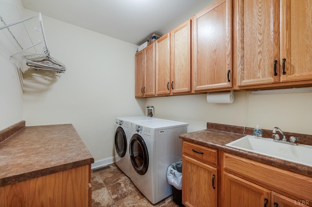 1310 Whispering Springs Ct, Forest, VA 24551 - washroom with cabinet space, a sink, separate washer and dryer, stone finish floor, and baseboards